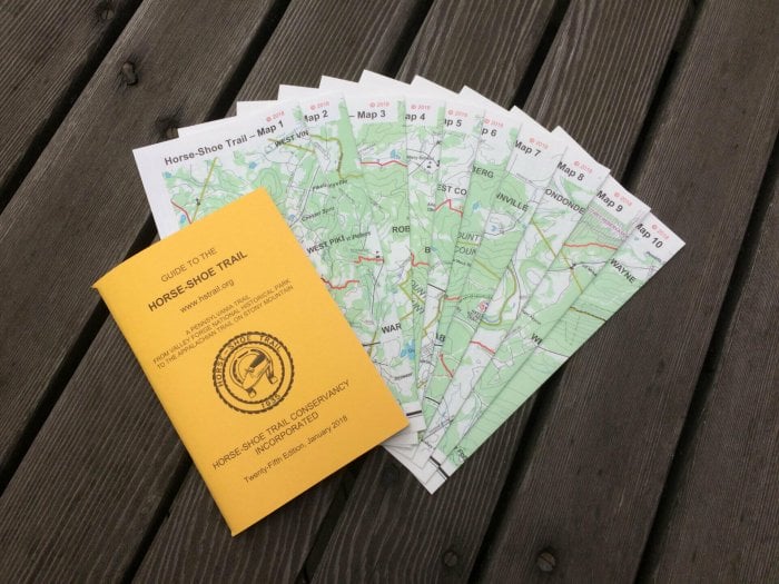 yellow guidebook with 10 color maps