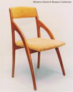chair whose front legs arch up to meet the back of the chair well above the seat rather then ending at the seat.