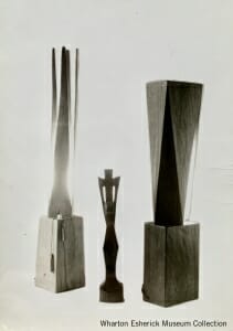 two wood lamps with crucifix in middle