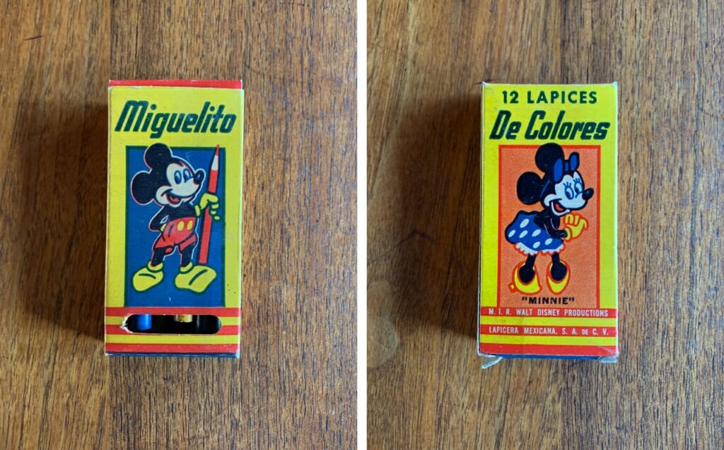 small colorful box with mickey Mouse and Minnie Mouse on it.