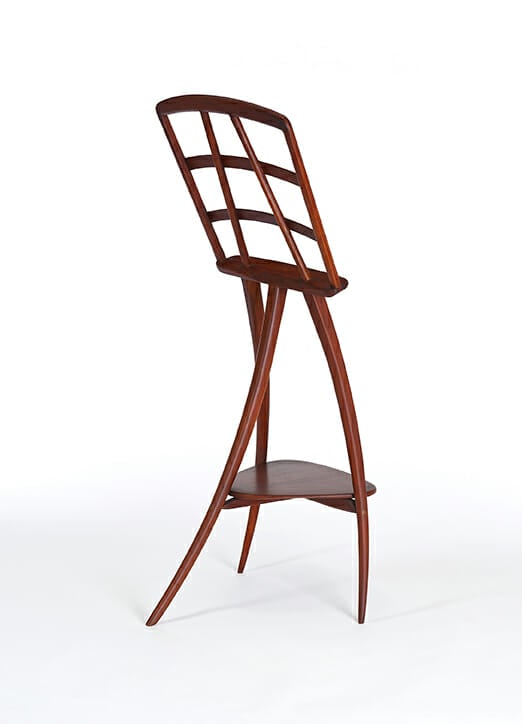 gracefully curving three legged wood music stand