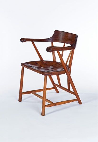 wood chair with armrests and laced leather seat
