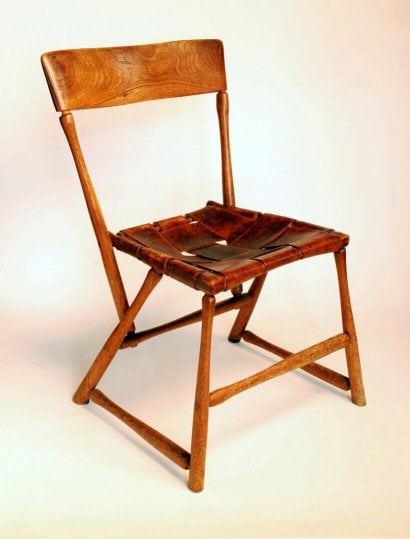 chair made from hammer handles with red painted laced canvas seat