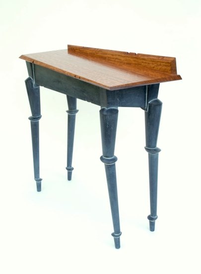 hall table with legs that appear jointed or precariously stacked, and a top that has askew angles