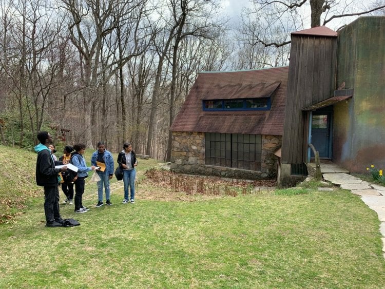 a group of students stand outside sketching the Esherick Studio 
