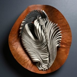 folds of fabric in a wood vessel