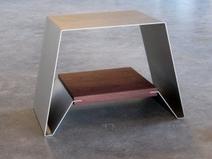 sheet of metal and wood formed to make a bench or stool