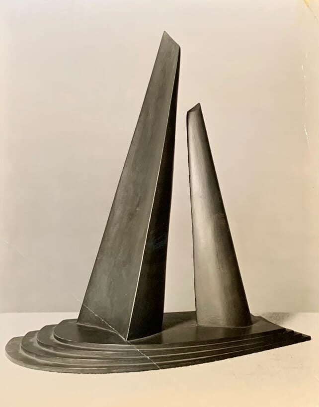 black and white photo of painted model for monument with two monoliths