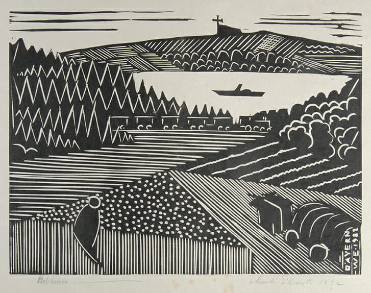 black woodcut print on white paper show a landscape depicted in angular, patterned styles. The is a figure and an ox-cart in the foreground and in the distance a train and a lake.