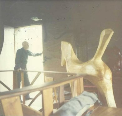 Wharton inside his studio with a large horse sculpture