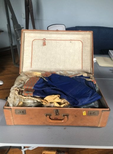 Suitcase filled with weaving samples from Wharton's wife, Letty