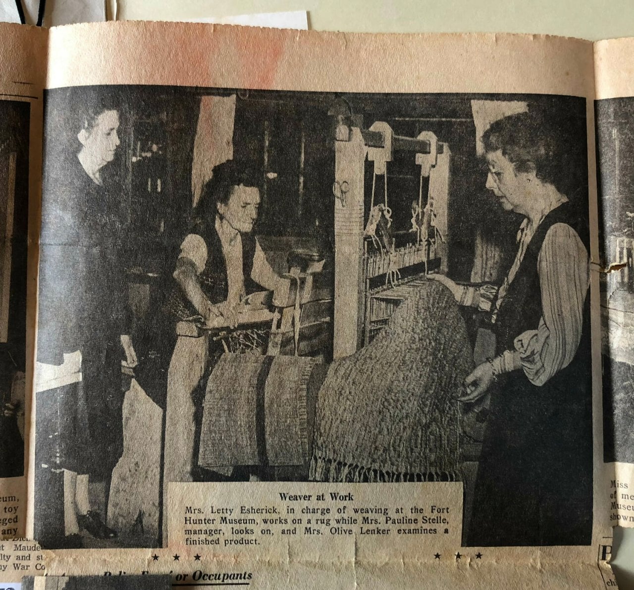 Photograph of newspaper featuring photograph of Letty teaching weaving