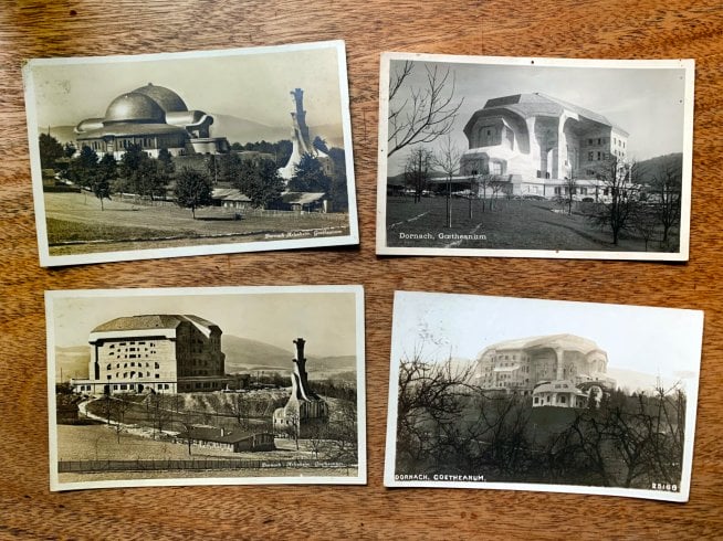 Four black and white postcards depicting two large buildings Steiner designed